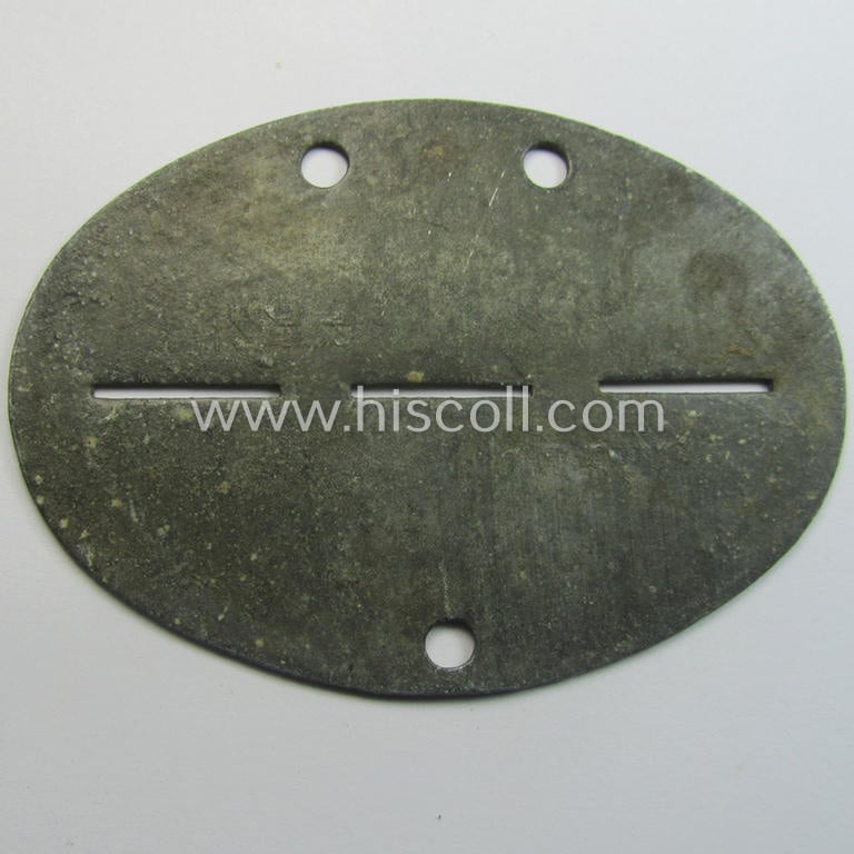 Zinc-based, 'Waffen-SS'-related ID-disc that shows the clearly stamped unit-designation: 'SS-Pz.Gren.A.u.E.Btl. 1' (= 'Leibstandarte Adolf Hitler' ie. 'LSSAH')