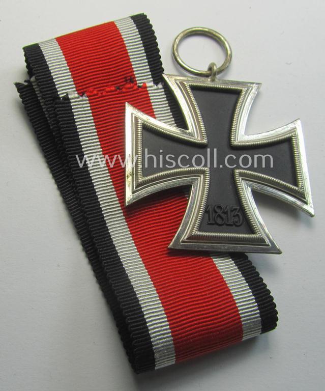 'Eisernes Kreuz II. Klasse' being a (typical) non-maker-marked example that comes together with its original- and never-mounted ribbon (ie. 'Bandabschnitt') as was produced by a (by me) unidentified maker (ie. 'Hersteller')