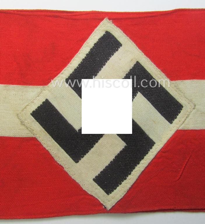 'Standard-issued'-pattern (ie. entirely woven) pattern, bright-red-coloured HJ- (ie. 'Hitlerjugend'-) related armband (ie. 'Armbinde') being a moderately worn- ie. used example that still retains its period 'RzM'-etiket