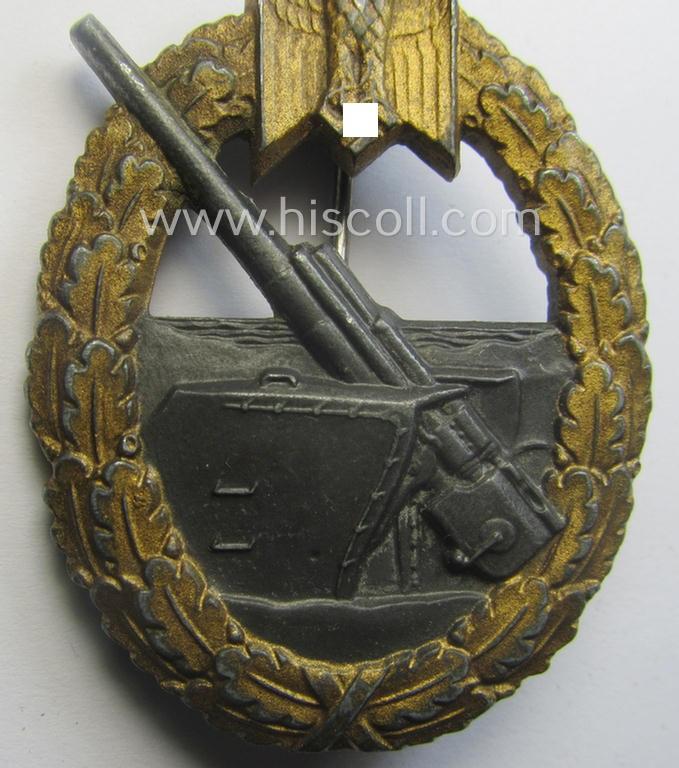 WH (KM) 'Marine-Artillerie-Abzeichen' being a maker- (ie. 'F.L.L. - 43'-) marked- and/or zinc- (ie. 'Feinzink'-) based example by the: 'Friedrich Linden'-company