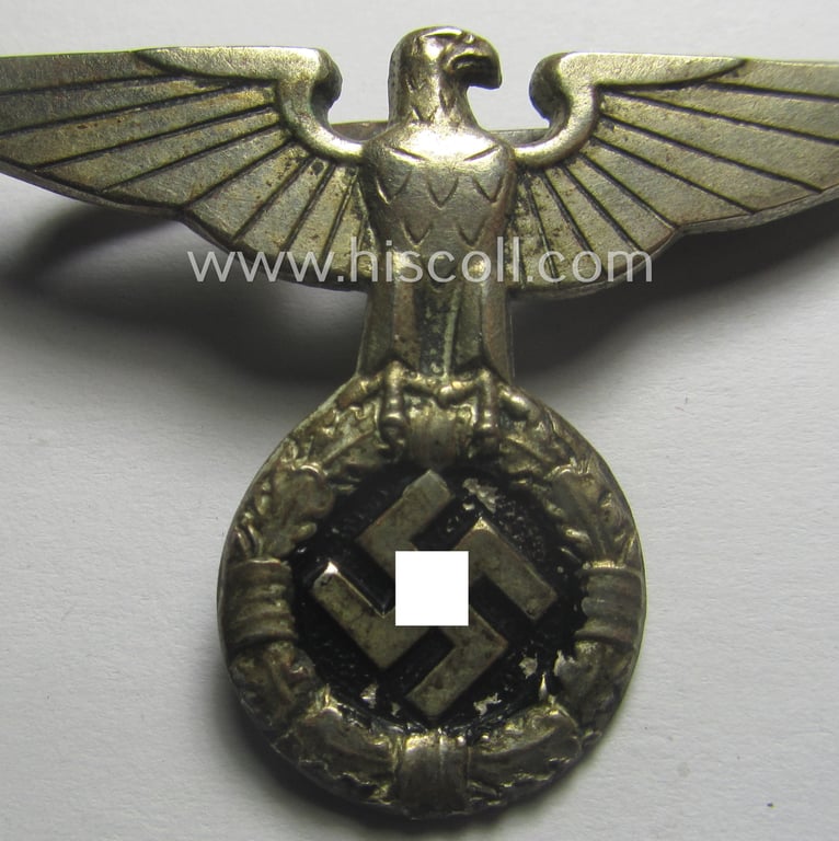 Silver-toned - and I deem 'Buntmetall'-based - early-pattern, SS- o. SA-type, political- ie. 'Art Deco'-styled visor- (ie. 'Schirmmützen'-) cap-eagle being a maker-marked (ie. 'RzM 52'-) marked example