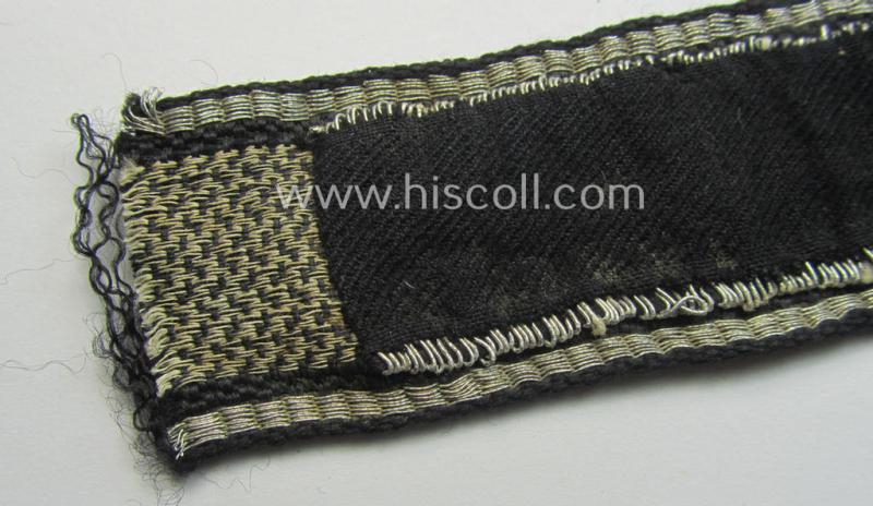 Relic- (ie. clearly shortened), Waffen-SS officers-type cuff-title (ie. 'Ärmelstreifen') as executed in flat-wire 'BeVo'-weave-pattern (in Gothic-styled script!) for an officer in the: SS-Rgt. 'Deutschland' (2. SS-Pz.-Div. “Das Reich”)