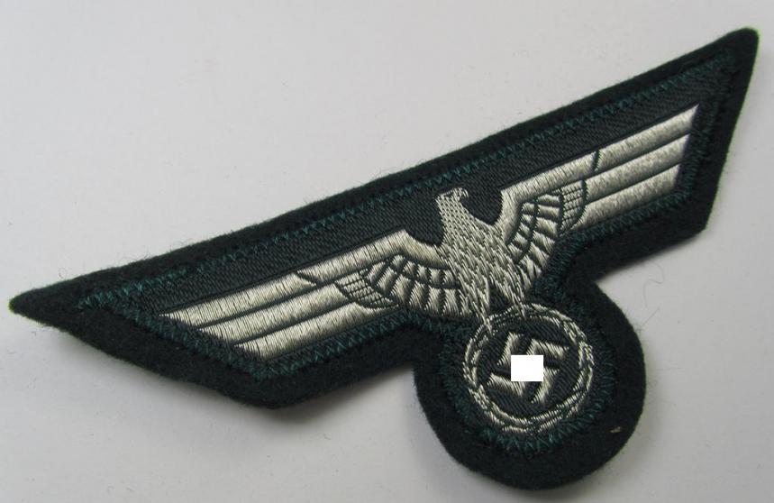 WH (Heeres) breast-eagle as executed in 'BeVo'-type-, so-called: 'flat-wire'-weave-pattern and pre-mounted on darker-green-coloured wool, as was intended for usage by soldiers (ie. NCOs) on their dress-tunics (ie. 'Waffenröcke')