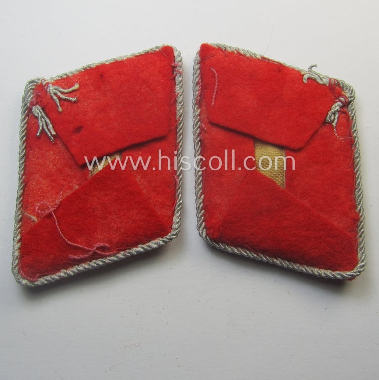 Truly used- and/or worn, 4-pieced WH (LW) insignia-set comprising of a pair of hand-embroidered, WH (Luftwaffe) officers'-type collar-patches and dito shoulderboards: 'Hauptmann der Flak-Artillerie-Trpn.'
