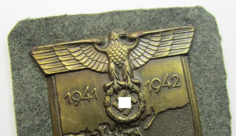 Attractive - albeit minimally rust-stained - WH (Heeres ie. Waffen-SS) 'Krim'-campaign-shield (as was produced by a by me unidentified maker) and that comes in a presumably issued - albeit 'virtually mint', condition