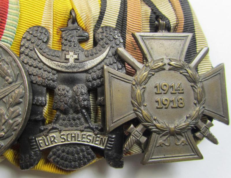 Attractive, 4-pieced medal-bar (ie. 'Ordenspange') respectively depicting a WWI-period: 'EK II. Klasse', an: Austrian/Hungarian WWI commemorative medal, a: 'Schlesisches Bewährungsabz. der II. Kl.'  and a: 'FKK 1914-18 m. Schw.'