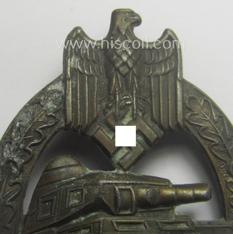 'Panzerkampfabzeichen in Bronze' (or: bronze-class panzer-assault badge or PAB) being a clearly maker- (ie. 'AS' in a triangle-) marked- and/or typical zinc- (ie. 'Feinzink'-) based specimen as was procuced by a to date unknown maker