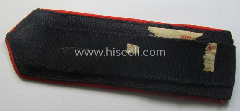 Superb - and rarely encountered! - red-piped, so-called: 'Allgemeine' HJ ('Hitlerjugend') shoulderstrap as was intended for a student who served within one of the: 'Adolf Hitler Schulen' (still having the remains of its 'RzM'-etiket attached)
