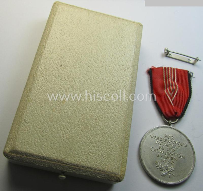 Superb, 'Deutsche Olympia-Erinnerungsmedaille 1936' being a non-maker-marked example that comes mounted onto its original ribbon (ie. 'Bandabschnitt') and that comes stored in its typical, beige-white-coloured etui as issued and stored for decade...