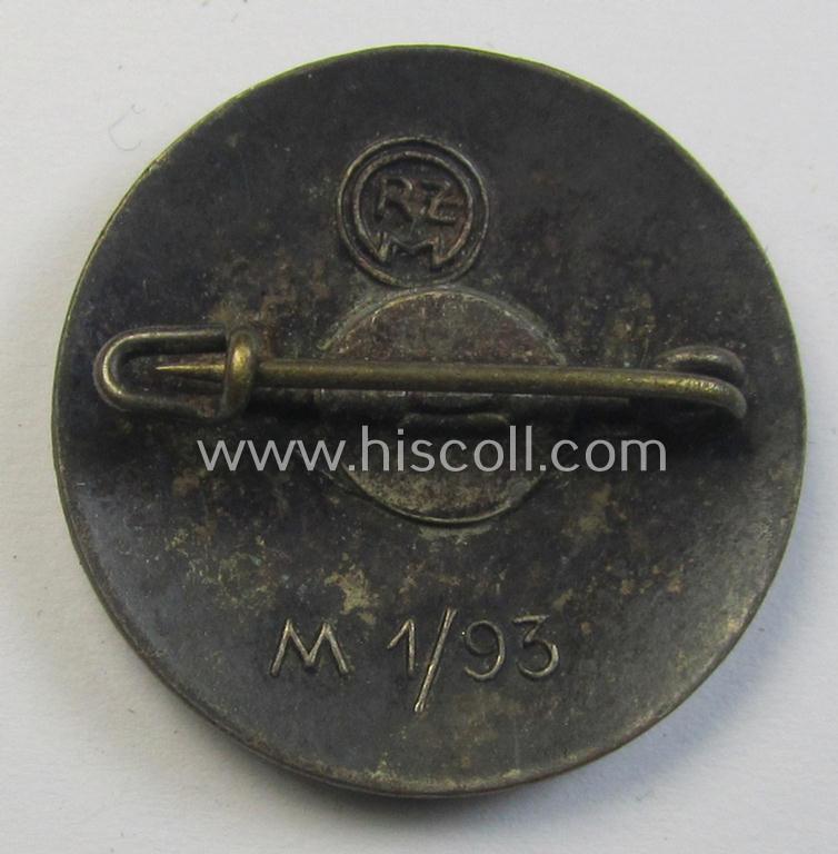 Attractive - bright-red-coloured and nicely preserved! - 'N.S.D.A.P.'-membership-pin- ie. party-badge (or: 'Parteiabzeichen') which is maker-marked on its back with the makers'-designation: 'RzM' and/or: 'M1/93'