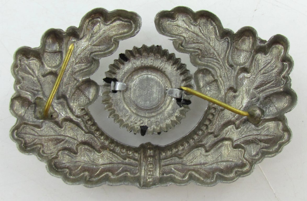Wehrmacht (Heer) visor cap wreath and cocarde ( DRGM marked )