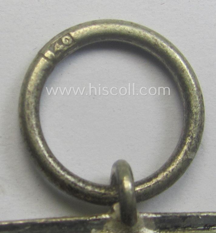 'Eisernes Kreuz II. Klasse' being a maker- (ie. '40'-) marked example that comes together with its non-confectioned ribbon (ie. 'Bandabschnitt') by the maker (ie. 'Hersteller'): 'Berg & Nolte'