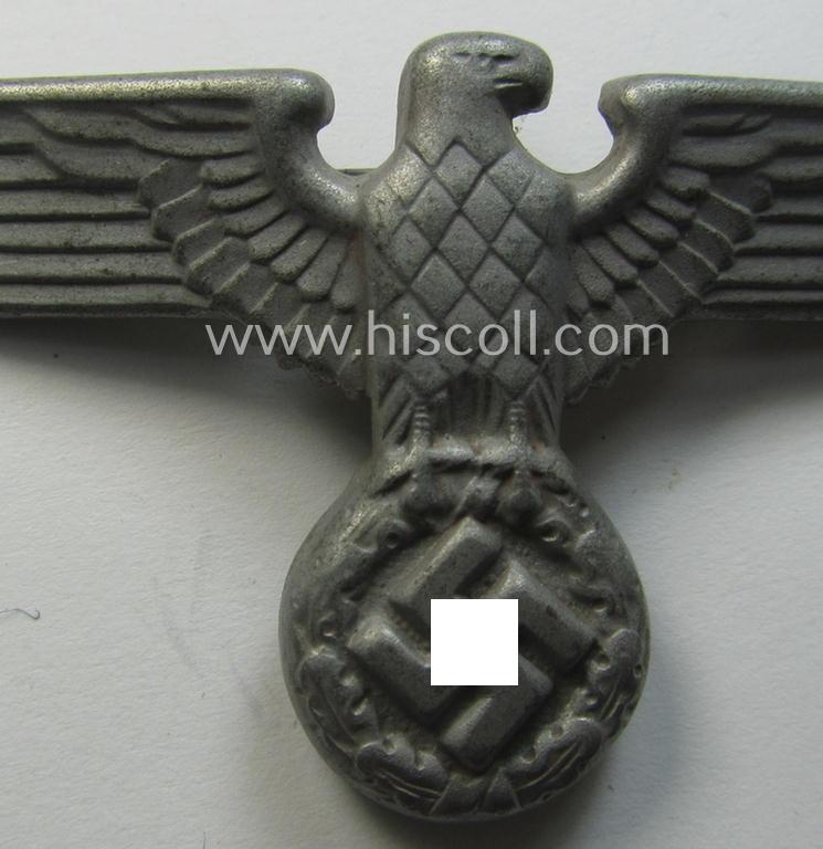 Greyish-silver-coloured- (ie. faded gold) and/or: zinc- (ie. 'Feinzink'-) based (political-style) visor- (ie. 'Schirmmützen'-) cap-eagle being a detailed example that is totally void of a makers'-designation