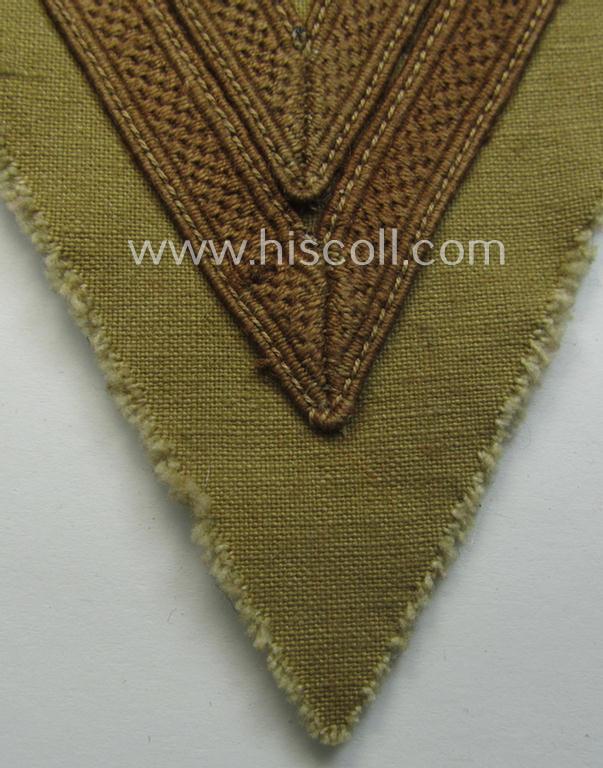 WH (Luftwaffe) tropical-styled, 'Armwinkel' (or: arm-chevron) as executed on typical beige- ie. tan-coloured linnen as was specifically intended for usage by a soldier with the rank of an: 'Obergefreiter'