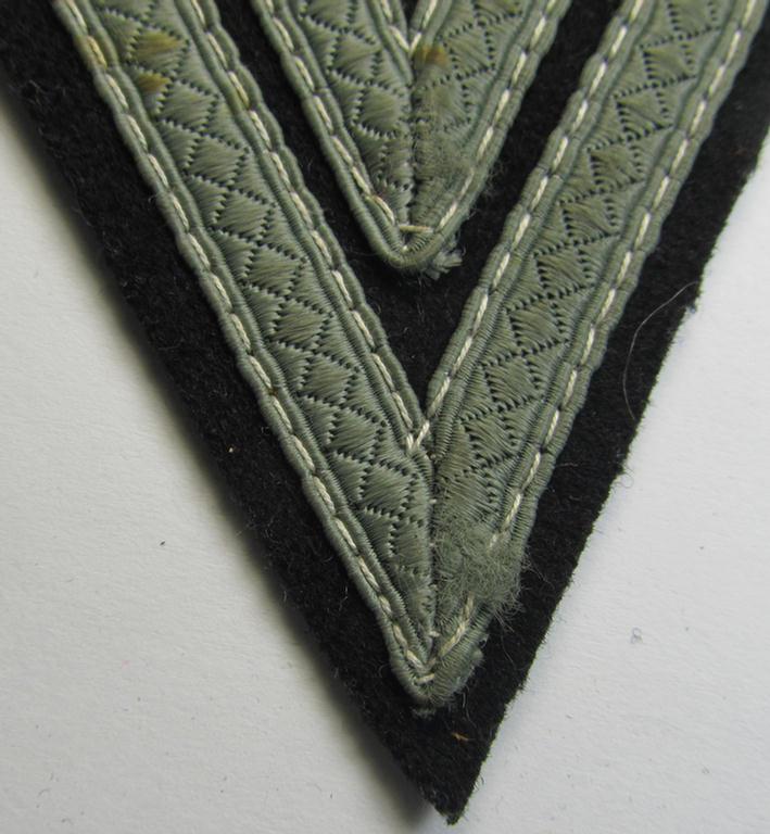 Attractive - and just moderately used! - Waffen-SS- (ie. Heeres Panzer-) type 'Armwinkel' (or: rank-chevron) as executed on black-coloured wool as was intended for an: 'SS-Rottenführer' (ie. 'Obergefreiter')
