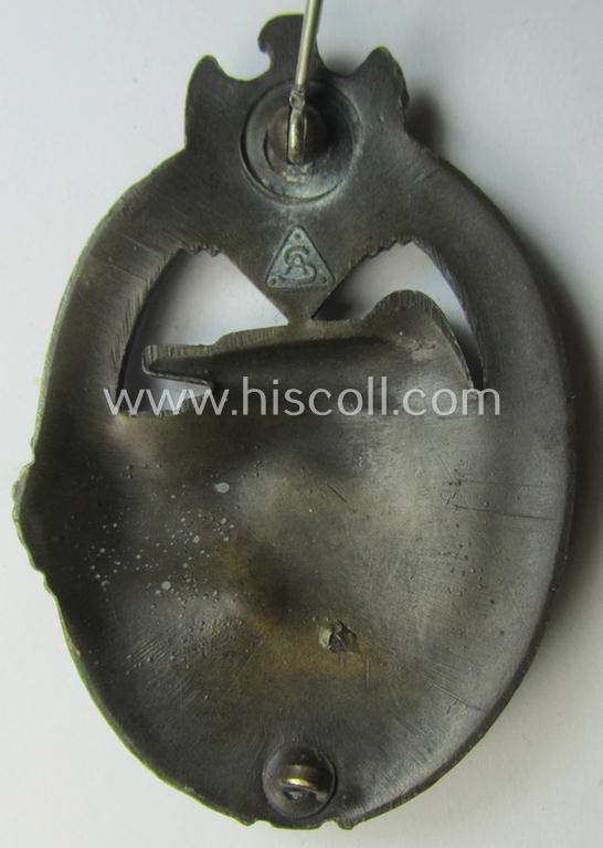 'Panzerkampfabzeichen in Bronze' (or: bronze-class panzer-assault badge or PAB) being a clearly maker- (ie. 'AS' in a triangle-) marked- and/or typical zinc- (ie. 'Feinzink'-) based specimen as was procuced by a to date unknown maker