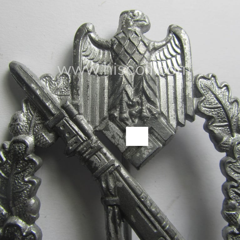 Zinc- (ie. 'Feinzink'-) based, 'Infanterie-Sturmabzeichen in Silber' being a maker- (ie. 'FZZ'-) marked example as being produced by the: 'Fritz Zimmermann'-company
