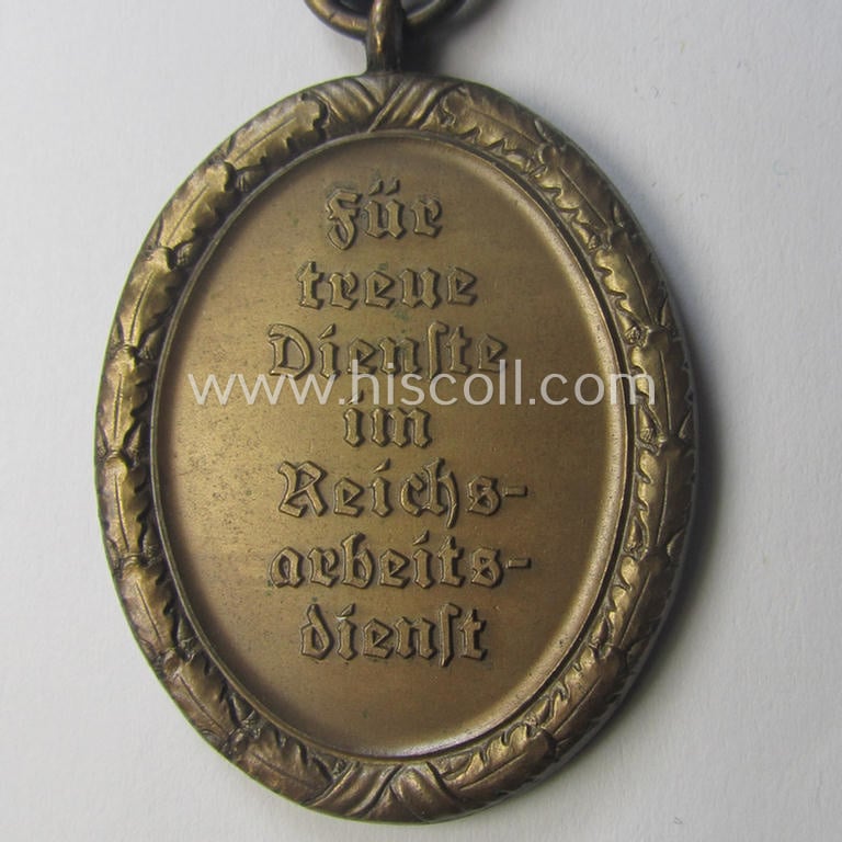 RAD (ie. 'Reichsarbeitsdienst'): 'Dienstauszeichnung 4. Stufe für Männer' as was intended for 4 years loyal-service and that comes mounted onto its period (broad-sized) ribbon (ie. 'Bandabschnitt')