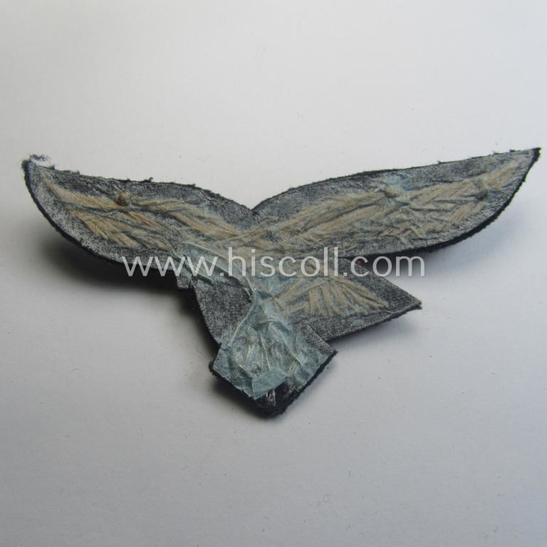 'Virtually mint' WH (Luftwaffe) officers'-pattern breast-eagle (ie. 'Brustadler für Offiziere der Luftwaffe') being a neatly hand-embroidered example of the: 'Extra Qualität' that comes in a never used- nor tunic-attached, condition