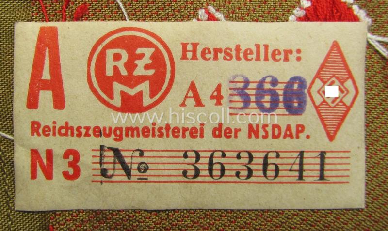 Attractive, DJ (ie. 'Deutsches Jungvolk') arm-badge as was intended for usage by a member who served within the: 'Oberbann 1' (being a 'virtually mint- ie. unissued' example that still shows its period-attached, 'RzM'-etiket)