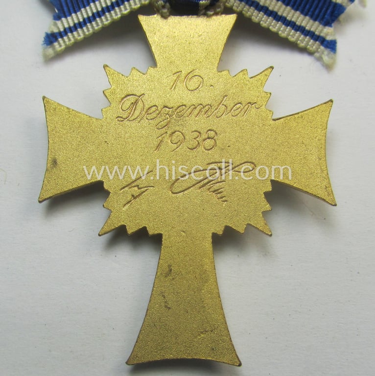 'Ehrenkreuz der deutschen Mutter - erste Stufe' (or: golden-class mothers'-cross) being a hardly used example that comes mounted onto its (unusually confectioned!) ribbon as issued and/or recently found