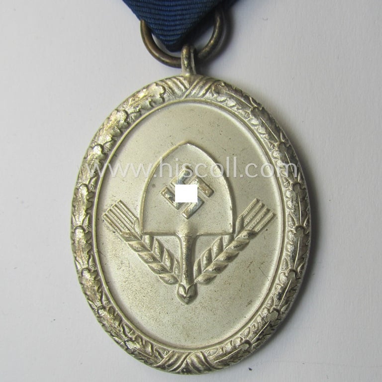 RAD (ie. 'Reichsarbeitsdienst') so-called: 'Dienstauszeichnung 3. Stufe für Männer' (as was intended for 12 years loyal-service) and that came mounted onto its period (albeit shortened) piece of ribbon (ie. 'Bandabschnitt')