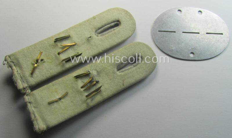 Unusual insignia-grouping comprising of a matching pair of WH (Heeres) officers'-type shoulderboards: 'Oberleutnant eines Inf.-Rgts.' that comes with its accompanying ID-disc (bearing the unit-designation: '1. Schütz.Ers.Kp. 106')