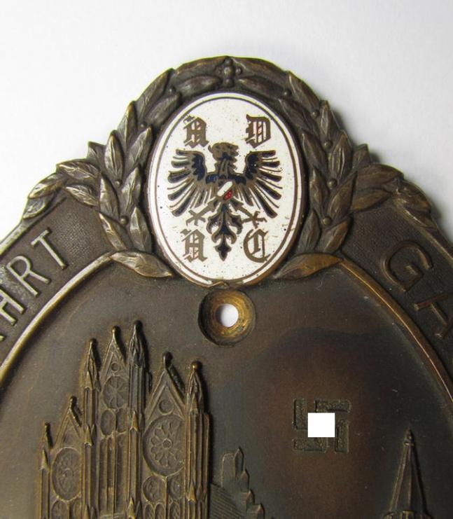 Commemorative, bronze-toned A.D.A.C.-related car-plaque (ie. 'Erinnerungs- o. nichttragbare Fahrzeug-Medaille des A.D.A.C.') showing two enamelled shields and text: 'Zielfahrt Gau IIb - Motor-Sp.-Club Tangermünde - 29.6.1930'