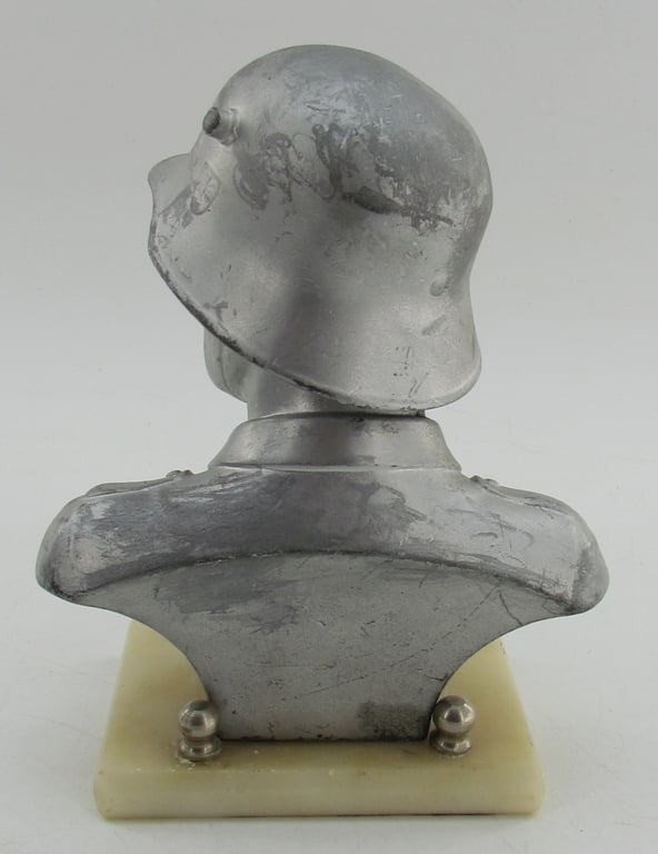 “German Wehrmacht soldier bust desk decoration on marble base.”