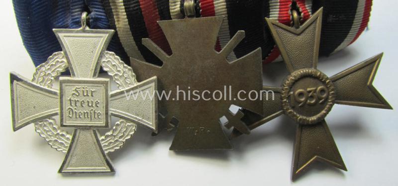 Three-pieced medal-bar (ie. 'Ordenspange') respectively depicting a: 'KvK II.Klasse o. Schw.', a: WWI-period: 'Frontkämpferkreuz 1914-18' (ie.: 'Kriegsteilnehmerkreuz mit Schwertern') and a: 'Treuedienst Ehrenzeichen 2. Klasse'