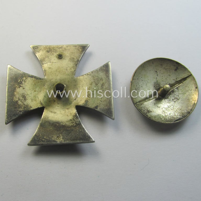 Moderately used, Iron Cross 1st class (or: 'Eisernes Kreuz 1. Klasse') as executed in the scarcely seen so-called: 'screw-back'- (ie. 'An der Schraube'-) pattern being a typical maker- (ie. 'L/16'-) marked example