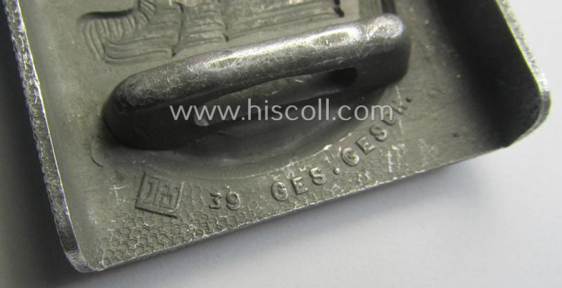 Aluminium-based, so-called: DRK (ie. 'Deutsches Rotes Kreuz'), enlisted-mens'- (ie. NCO-) type belt-buckle being a maker- (ie. 'JFS'-) marked and: 1939-dated example