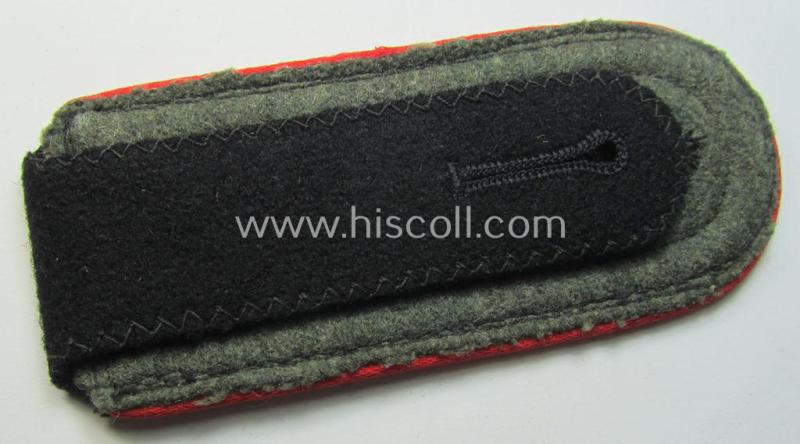 Single, Waffen-SS, NCO-type shoulderstrap as piped in the bright-red-coloured branchcolour as was intended for usage by an: 'SS-Unterscharführer' who served within the: 'SS-(Sturm)Artillerie-Trpn.'