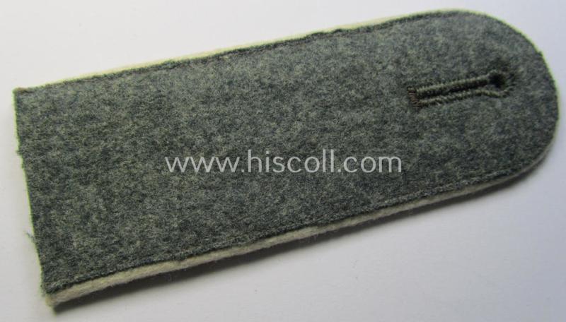 Single - and actually not that often seen! - WH (Heeres) EM-type (ie. 'M36-/M40'-pattern- and/or: 'rounded styled-') neatly 'cyphered' shoulderstrap as was intended for usage by a: 'Soldat des Infanterie-Regiments 1'