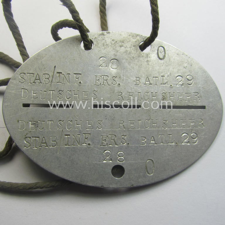 Aluminium-based, WH (Heeres) (ie. 'Infanterie o. Deutsches Reichsheer'-related) ID-disc bearing the clearly stamped unit-designation that reads: 'Stab/Inf. Ers.Batl. 29 - Deutsches Reichsheer' and that comes  mounted onto its (period-attached) cord