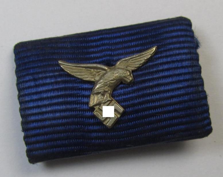 One-pieced medal-bar (ie. 'Band- o. Feldspange') as intended for the WH (Luftwaffe) 'Dienstauszeichnung für 4 Jahre Treue Dienste' (having a silver-coloured- and 'down-tail-type' eagle-device attached)