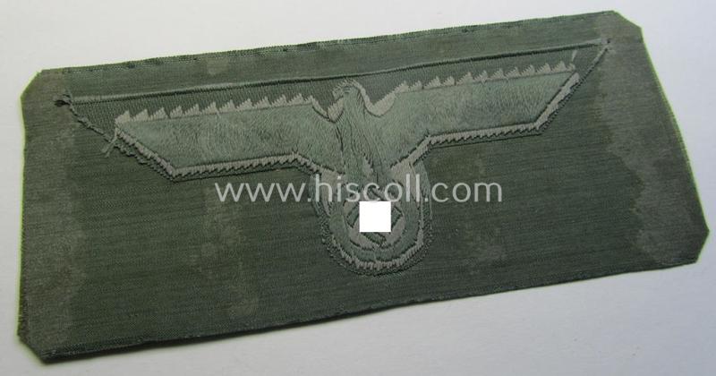 WH (Heeres) related breast-eagle (ie. 'Brustadler für Mannschaften u. Uffz. des Heeres') being a 'standard-issue'-pattern-example as executed in the 'BeVo'-weave-pattern on a field-grey-coloured background