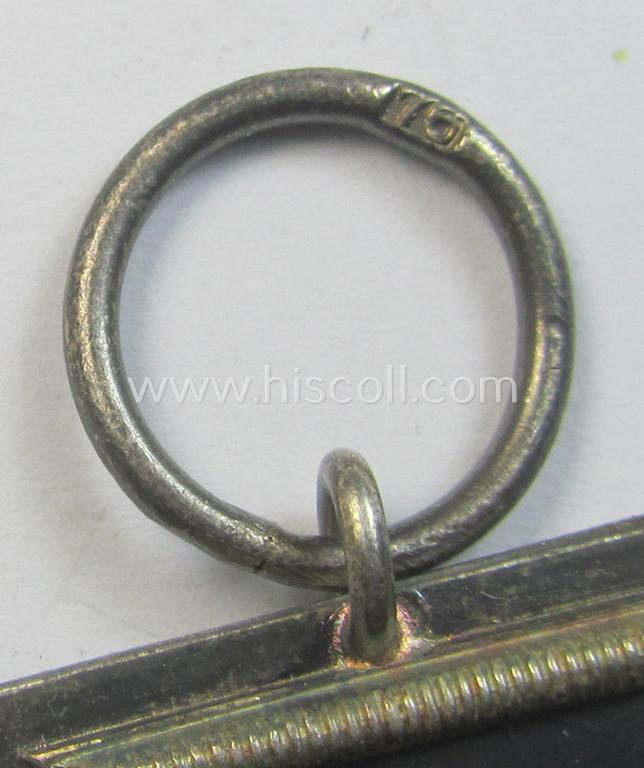 Attractive, Iron Cross 2nd class (or: 'EK II. Klasse') being a maker- (ie. '76'-) marked example that comes together with its non-confectioned ribbon (ie. 'Bandabschnitt') as was produced by the maker (ie. 'Hersteller'): 'Ernst L. Müller'