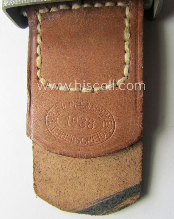 WH (Heeres) 'standard-pattern', field-grey-toned- and aluminium-based belt-buckle being a maker- (ie. 'R. Sieper & Söhne'-) marked- and/or: '1938'-dated example that comes mounted onto its leather-based tab