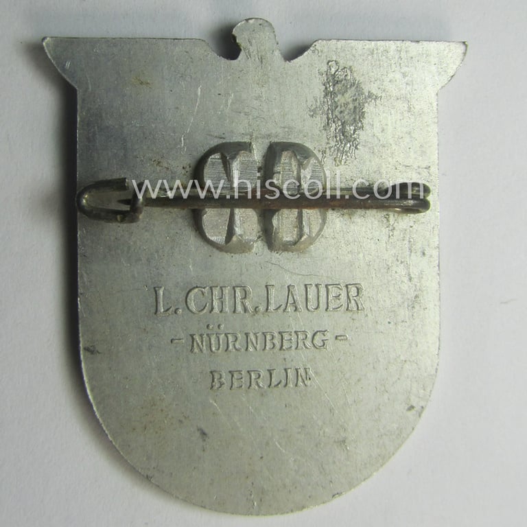 Commemorative, N.S.D.A.P.-related 'tinnie' depicting an illustration of a detailed 'Reichsadler'-device coupled with the text: 'NSDAP Gau Mecklenburg - Kreistag 1938 - Kreis Schwerin-Stadt'