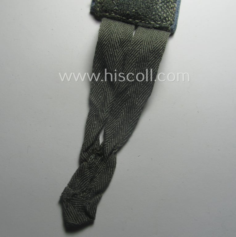 Single, WH (Heeres) later-war period- (ie. 'simplified'- ie. 'M44- o. M45'-pattern-) EM-type shoulderstrap: 'Soldat der Nachschub-Trpn.'