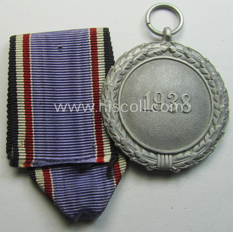 Neat, 'Luftschutz-Ehrenzeichen 2. Stufe' being a non-maker-marked example, as executed in (heavy) zinc-based metal (ie. 'Feinzink') and that came together with its period ribbon ie. 'Bandabschnitt'