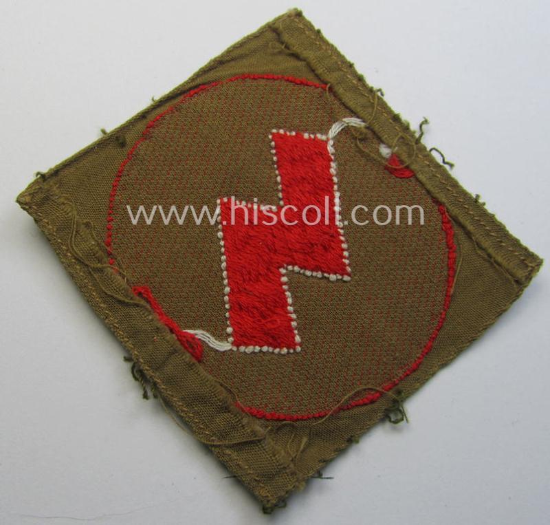 Truly used, DJ (ie. 'Deutsches Jungvolk') arm-badge as was specifically intended for usage by a member who served within the: 'Oberbann 1' (being a tunic-removed example that is void of an 'RzM'-etiket)