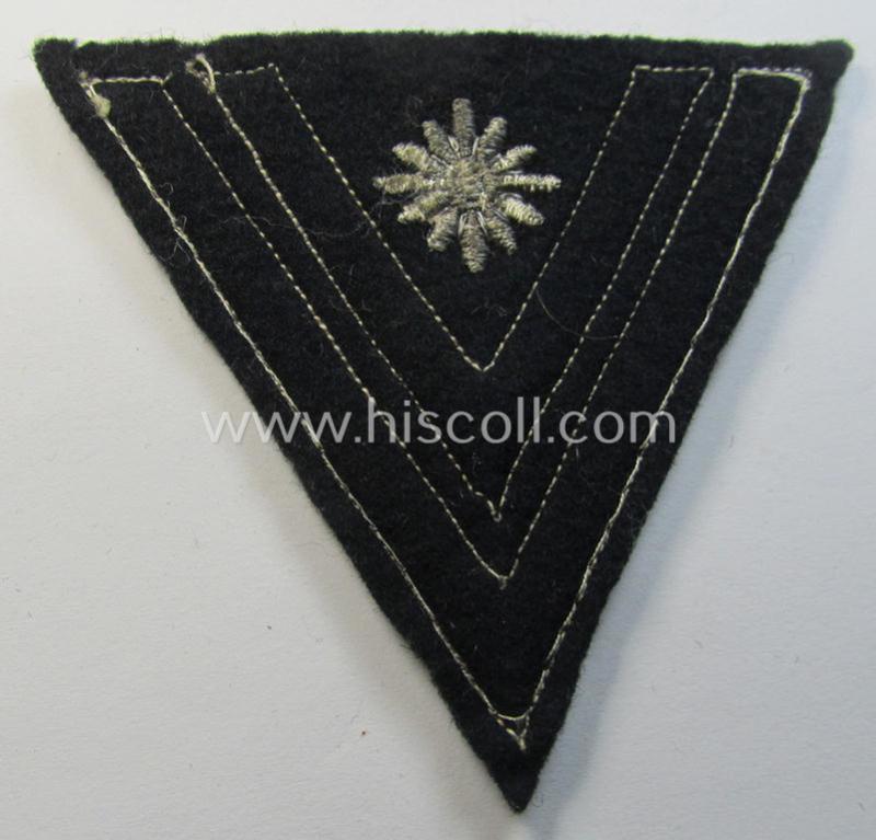 WH (Heeres) Pz-'Armwinkel' (or: rank-chevron) as intended for usage on the black-coloured 'Panzer'-type 'wrap-around'-tunics as was intended for usage by a soldier with the (unusually encountered!) rank of: 'Stabsgefreiter'