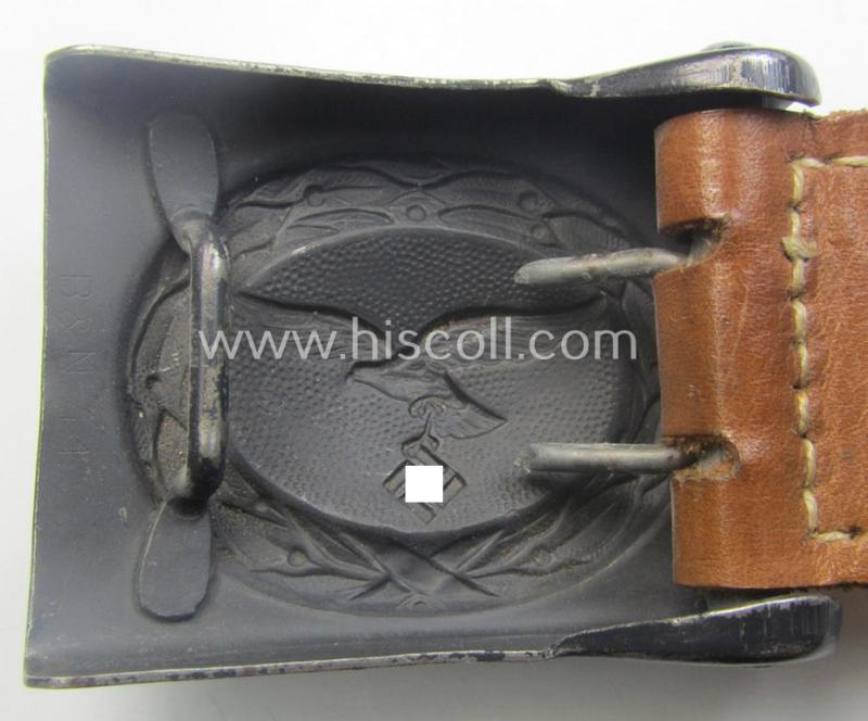 'Virtually mint', 'standard-issue'-pattern, WH (Luftwaffe) bluish-grey-toned- and steel-based belt-buckle being a non-maker-marked example that comes mounted onto its 'Berg u. Nolte A.G.'-marked and/or '1941'-dated tab