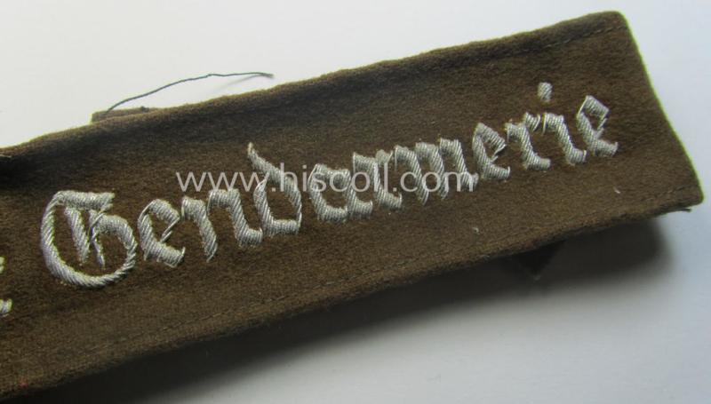 Truly used - and actually scarcely found! - police- ie. 'Gendarmerie'-related cuff-title ie. armband (ie. 'Ärmelstreifen') entitled: 'Motorisierte Gendarmerie' (being a hand-embroidered officers'- ie. evt. NCO-pattern example)
