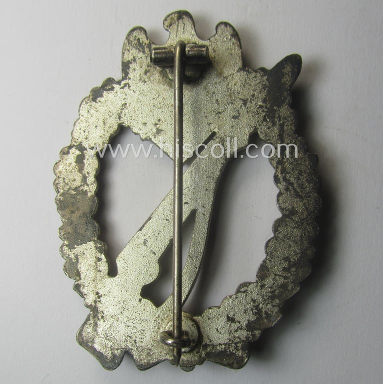 'Infanterie-Sturmabzeichen in Silber' being a non-maker-marked, 'solid-back'- and/or typical zinc- (ie. 'Feinzink'-) based specimen of the so-called: 'egg-head'-pattern (as was presumably produced by the: 'Gustav Brehmer'-company)