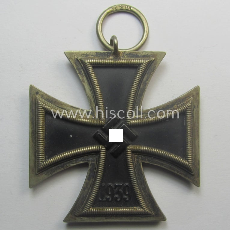 Iron Cross 2nd class (or: 'EK II. Klasse') being a maker- (ie. '120'-) marked example that comes together with its original ribbon (ie. 'Bandabschnitt') as was produced by the (not that often seen!): 'Franz Petzl'-company