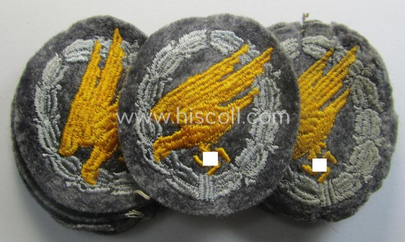 WH (Luftwaffe) 'Fallschirmschützen-Abzeichen in Stoff' (or: cloth-based paratroopers'-jump-badge) being nicely machine-embroidered specimen that come in a never used- ie. 'virtually mint-/unissued', condition