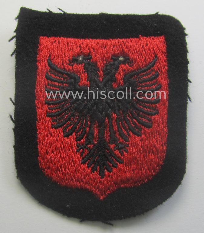 Albanian, Waffen-SS 'volunteer' arm-shield as was specifically intended for usage by soldiers of the: '21. Waffen-Grenadier-Division der SS' (ie. 'Skanderbeg' or: 'albanische Nr. 1') that comes in a 'virtually mint- ie. unissued', condition
